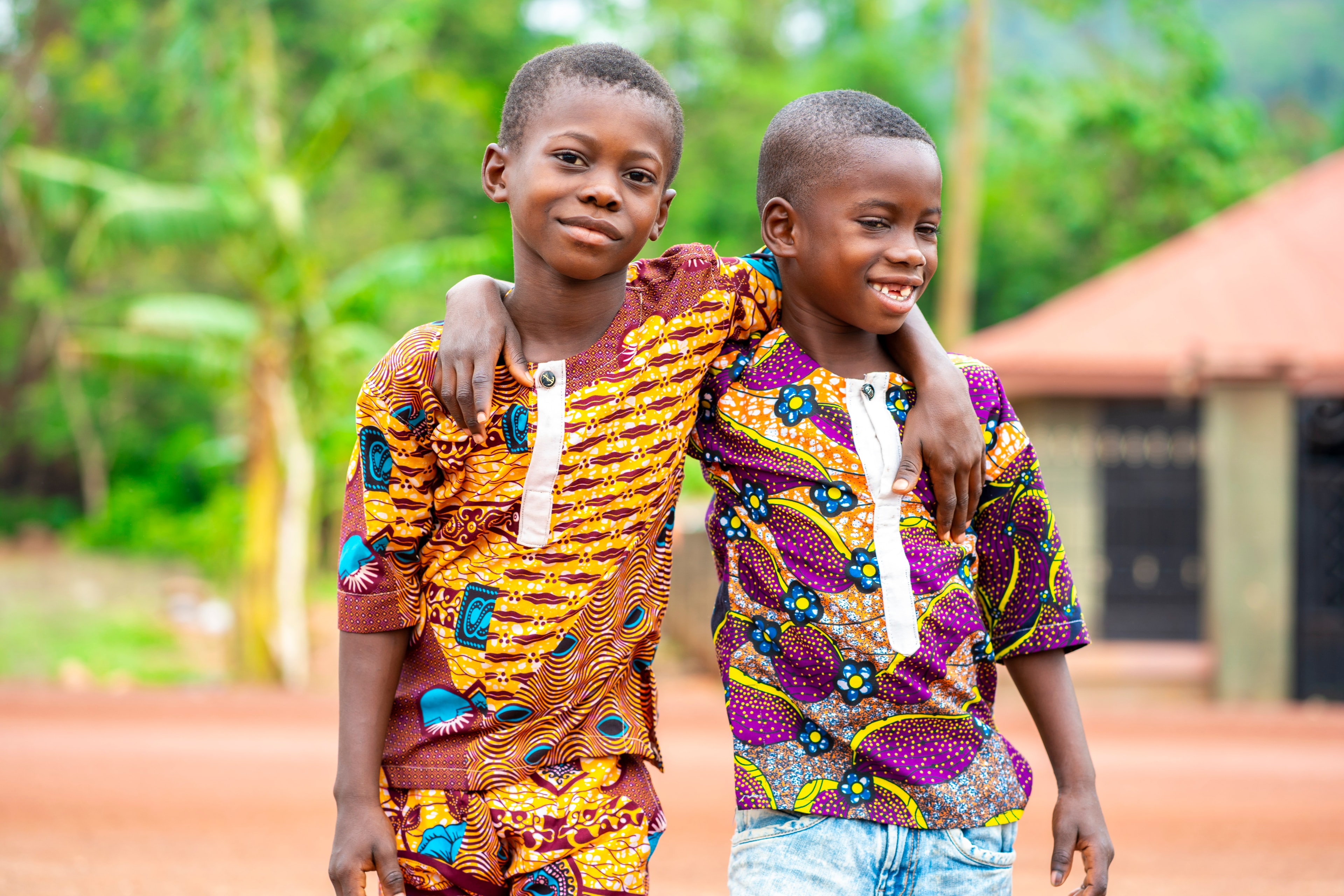 Children smiling, supported by community giving